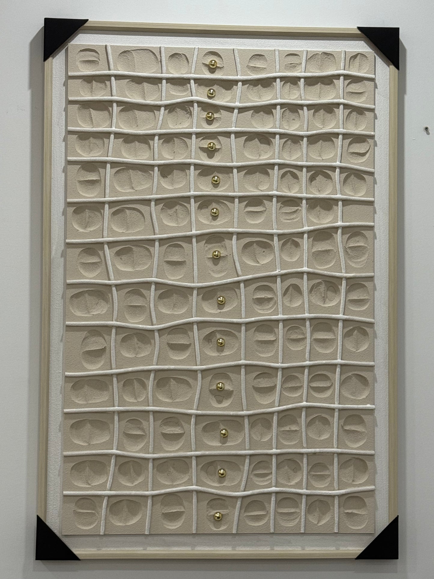 Framed artwork with textured pattern