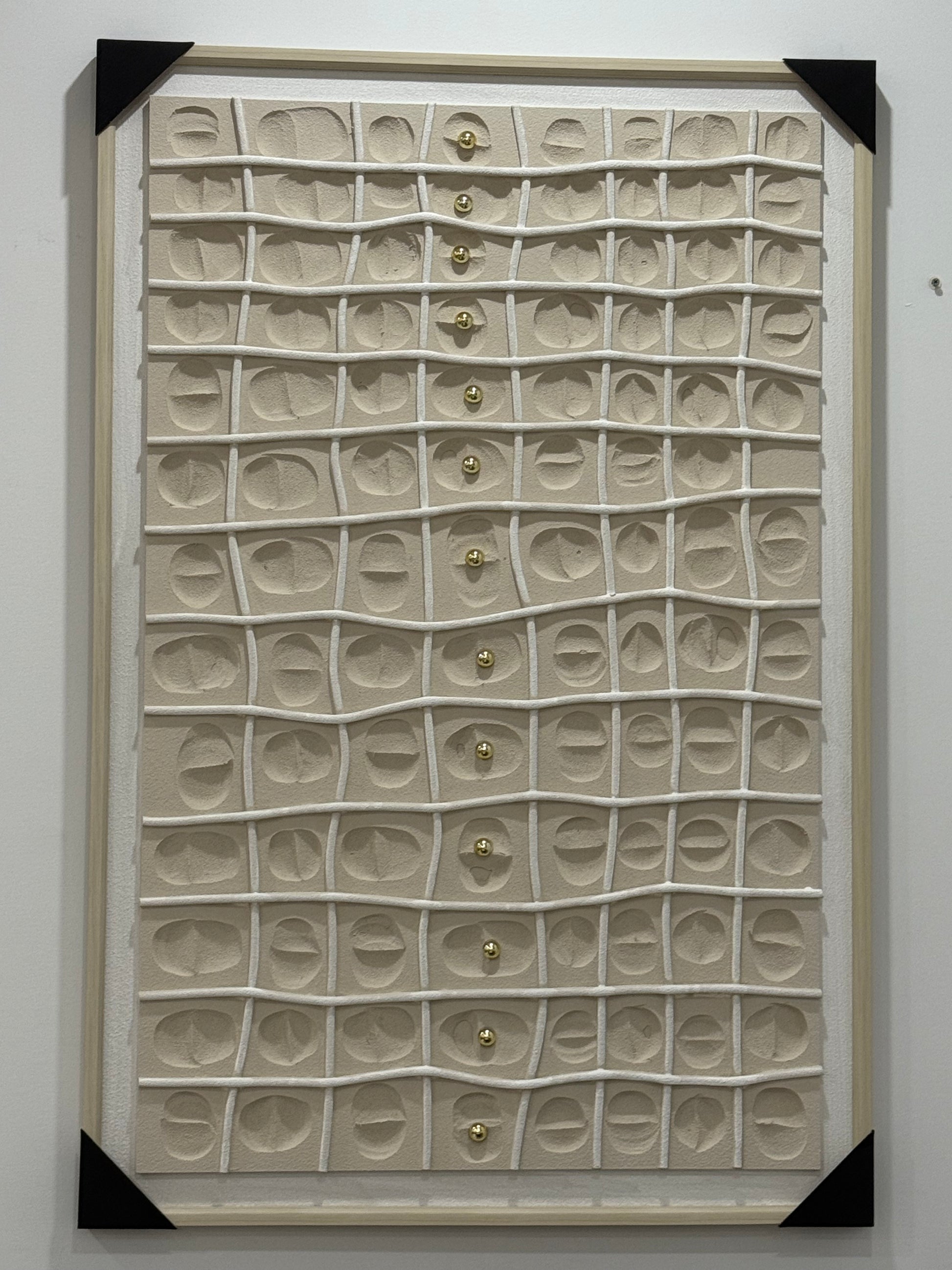 Framed artwork with textured pattern